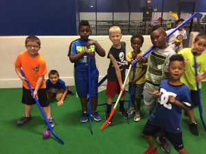 all sports kids smiling playing hockey