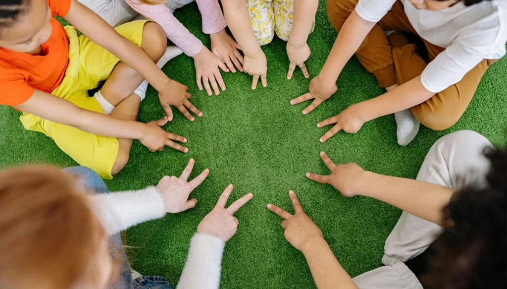 children's hands in a circle