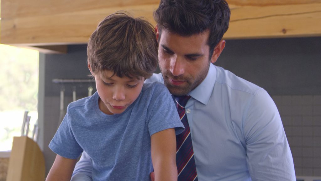 father and son looking down