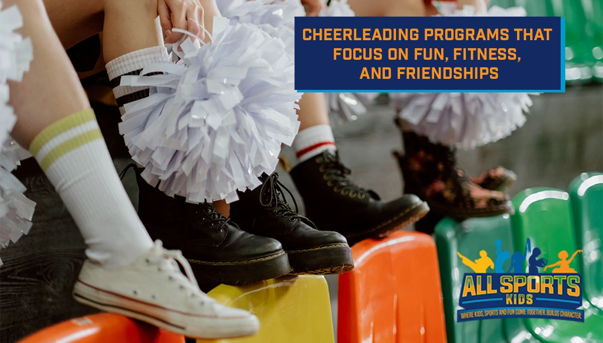 Young girls resting their feet and pom poms on chairs